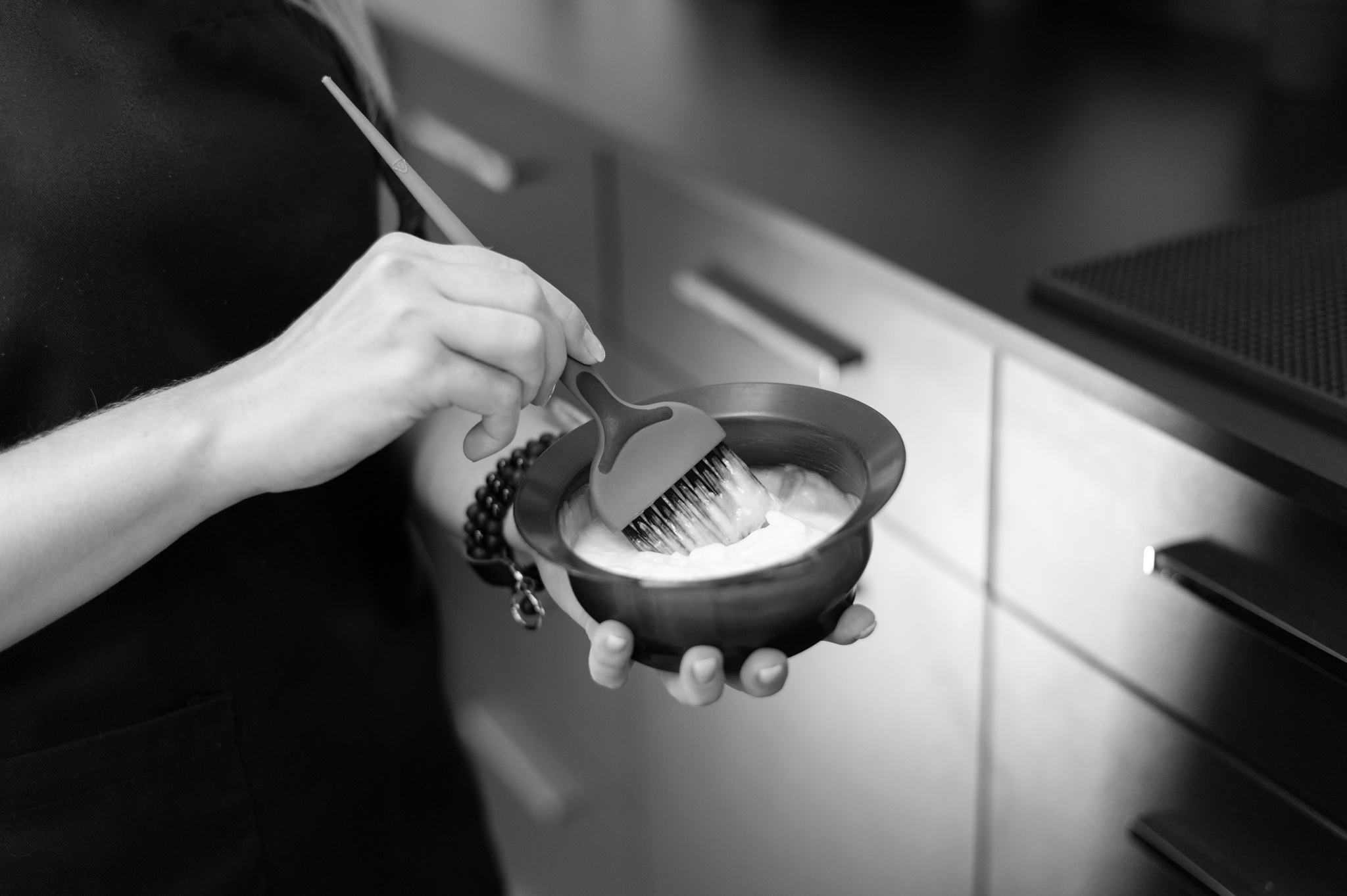 woman mixing hair dye bowl 2